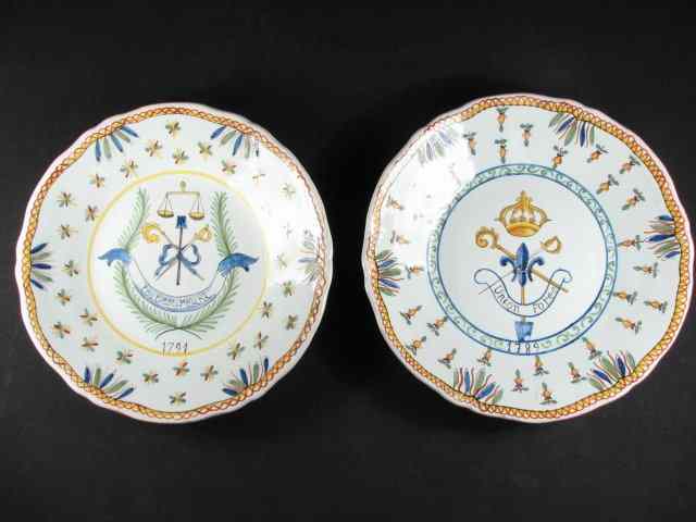 Appraisal: French faience armorial plates Both measures '' in diameter and