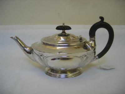 Appraisal: A VICTORIAN BACHELOR'S TEAPOT of oval half fluted form with