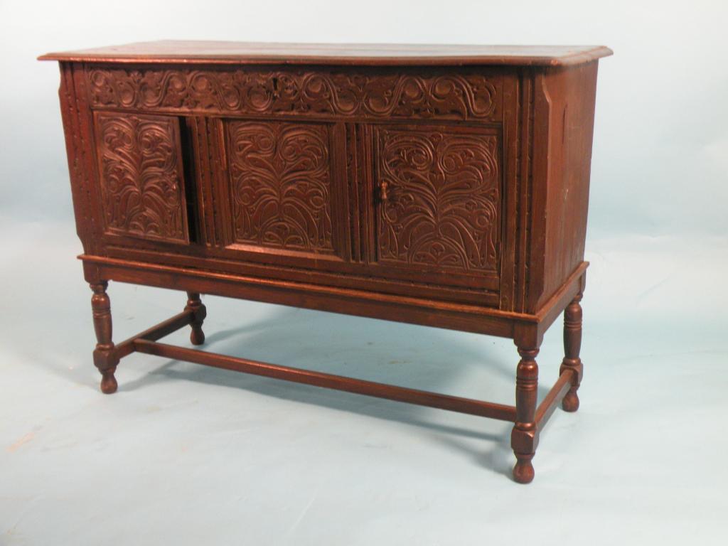 Appraisal: An early thC carved oak sideboard with an arrangement of