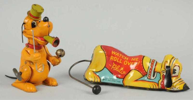 Appraisal: Lot of Walt Disney Pluto Wind-Up Toys Working Includes one