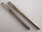 Appraisal: Two English hallmarked silver ball point pens one with makers