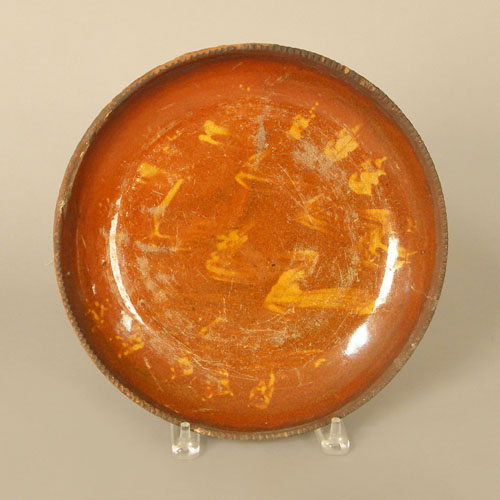 Appraisal: Pennsylvania slip decorated redware plate th c dia