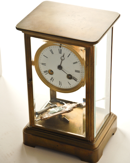 Appraisal: A French Brass Carriage-style Clock having beveled glass to all