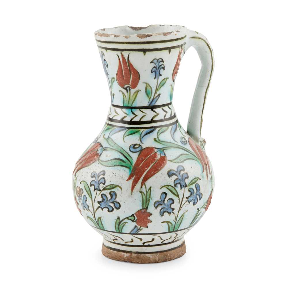 Appraisal: AN IZNIK POTTERY JUG WITH TULIPS AND HYACINTHS OTTOMAN TURKEY