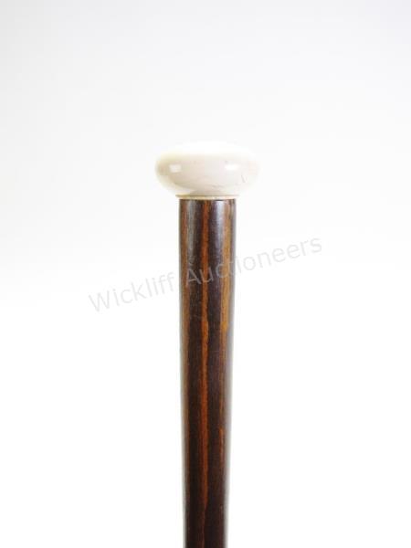 Appraisal: Dart Game Cane segmented wood and metal shaft carved handle