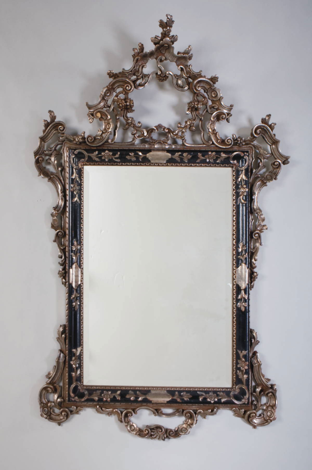 Appraisal: LARGE ITALIAN CARVED AND SILVERED WALL MIRROR WITH PIERCED CREST