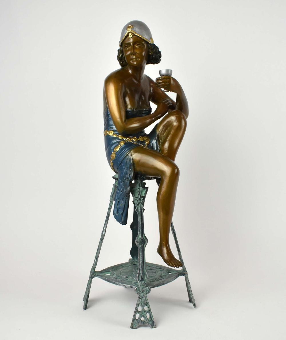 Appraisal: PATINATED BRONZE FLAPPERModern Unsigned Scantily clad and seated upon a