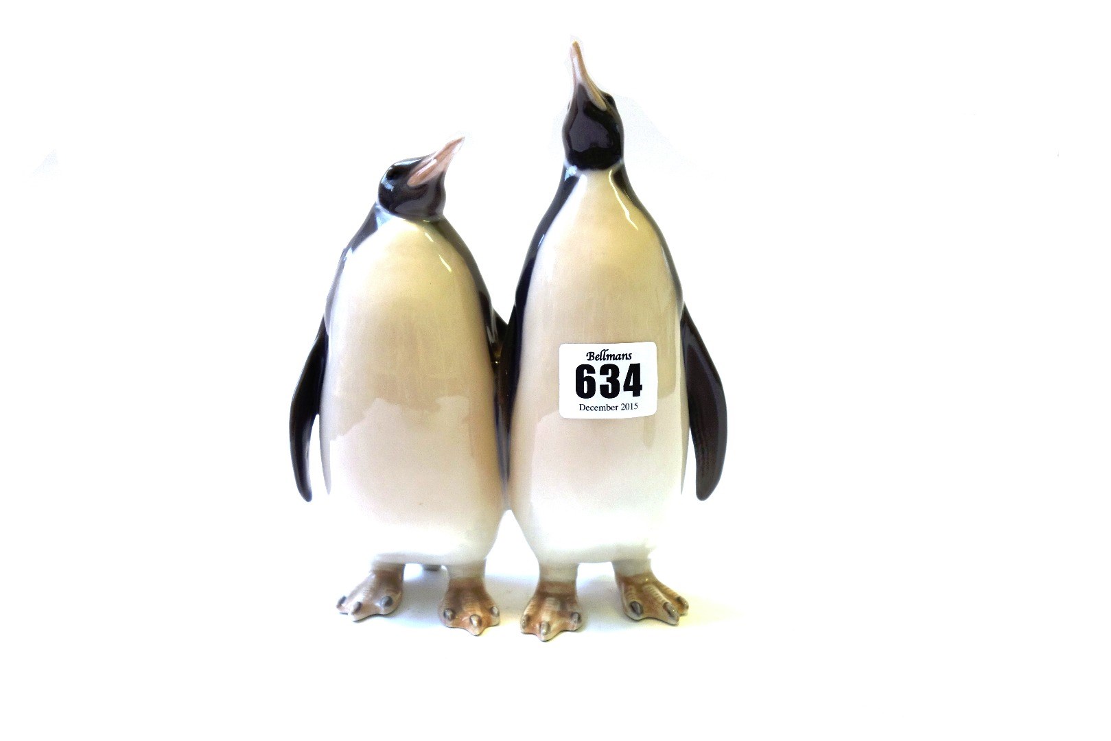 Appraisal: A Royal Copenhagen penguin group no cm high and a