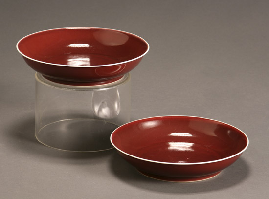 Appraisal: Pair Chinese Copper-Red Glazed Dishes Each with Underglazed Blue Qianlong