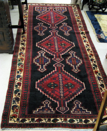 Appraisal: PERSIAN TRIBAL CARPET overall geometric design on plain midnight blue