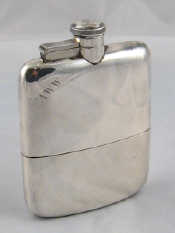 Appraisal: A silver whisky hip flask with cup James Dixon Sons