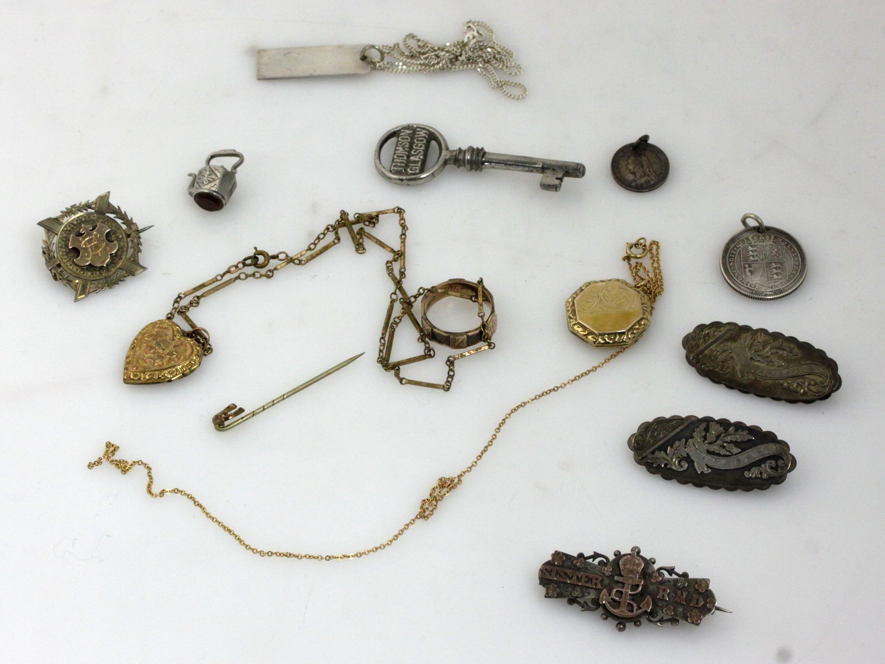 Appraisal: A group of silver brooches and coin brooches