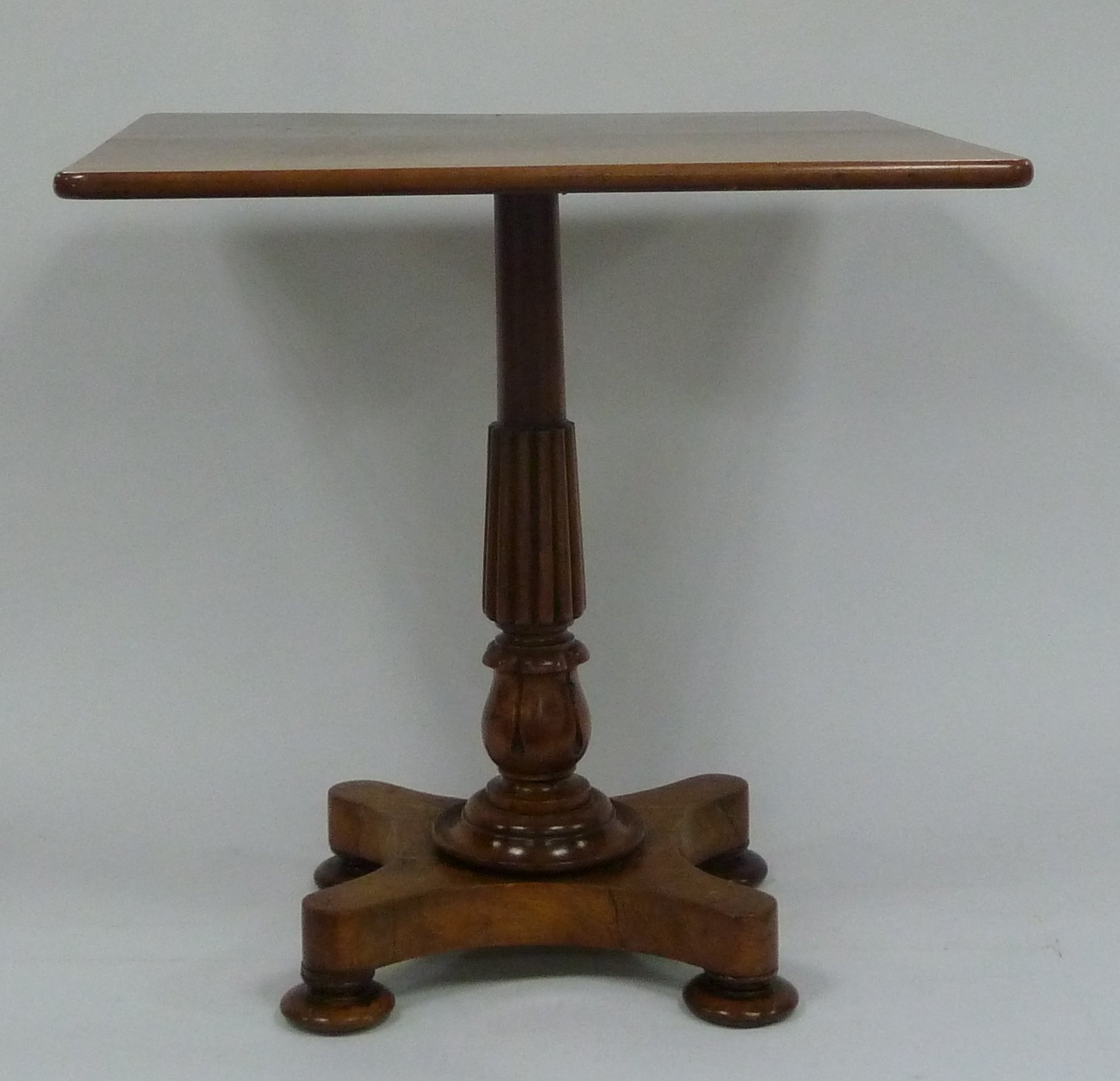 Appraisal: A Victorian mahogany square table on a reeded and turned