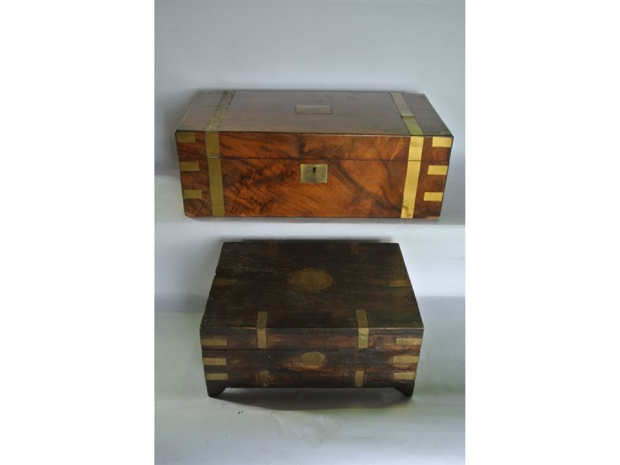 Appraisal: A Victorian mahogany veneered writing box with brass lock escutcheon