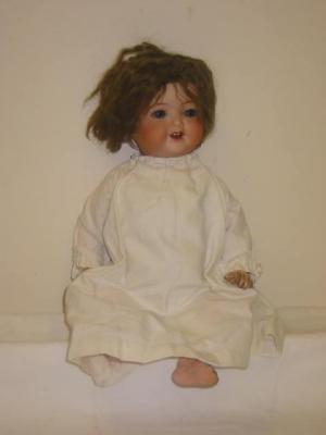 Appraisal: An Armand Marseille bisque head girl doll with blue glass