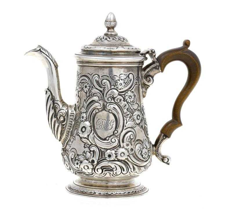 Appraisal: A COFFEE POT of baluster shape the ogee domed cover