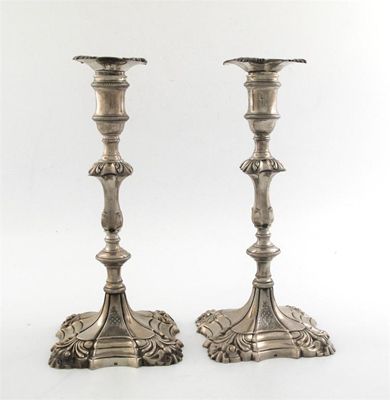 Appraisal: A pair of George II cast candlesticks with knopped baluster