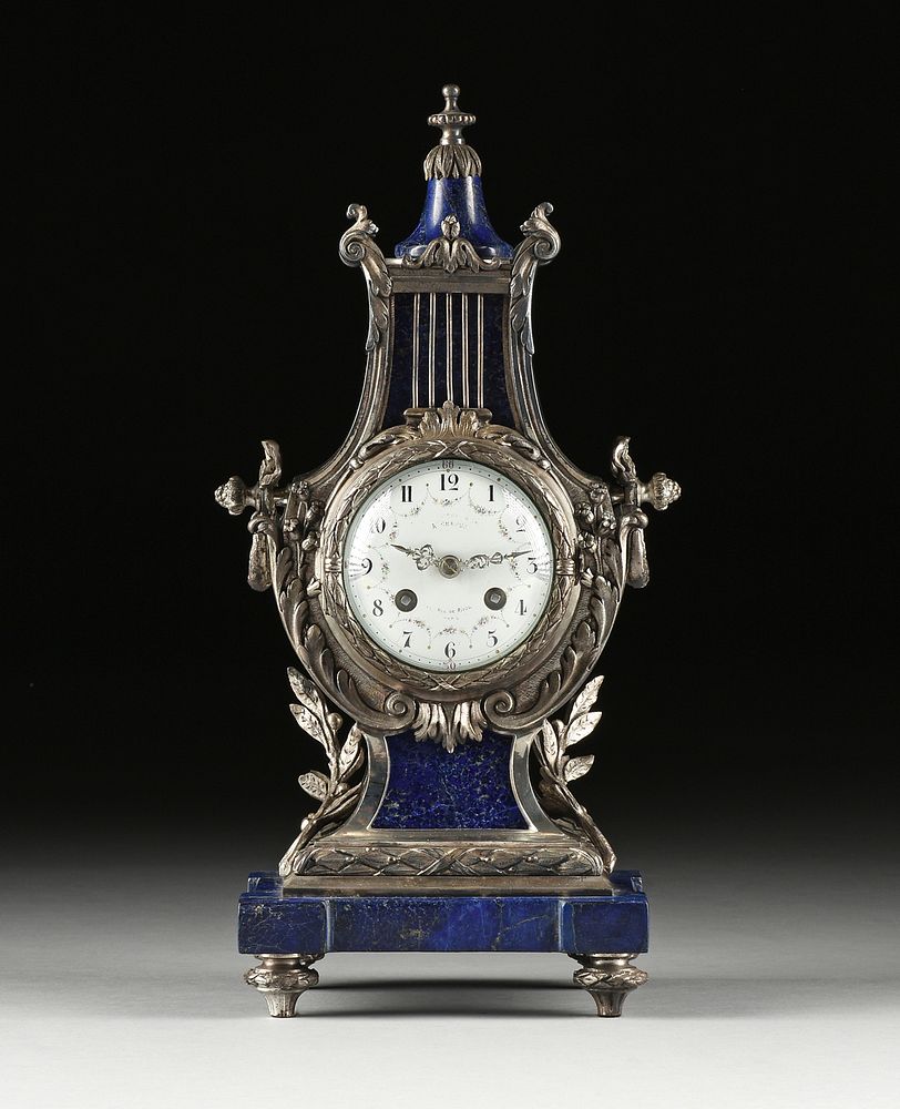 Appraisal: A LOUIS XVI STYLE SILVERED METAL AND LAPIS LYRE FORM