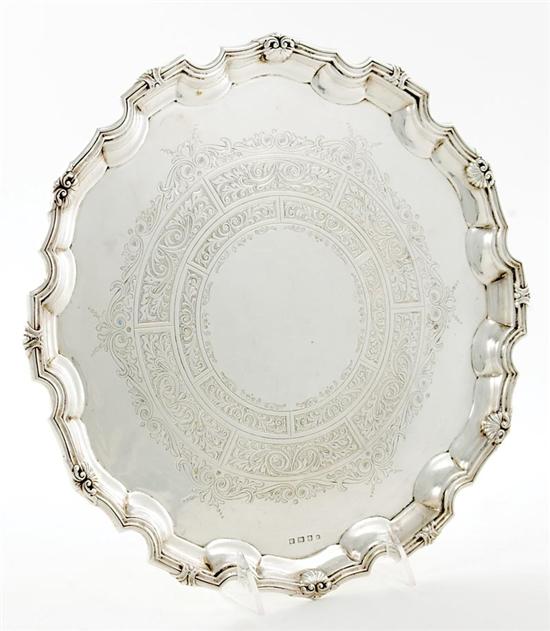 Appraisal: English Edwardian sterling salver Birmingham dated shell-capped shaped rim centering