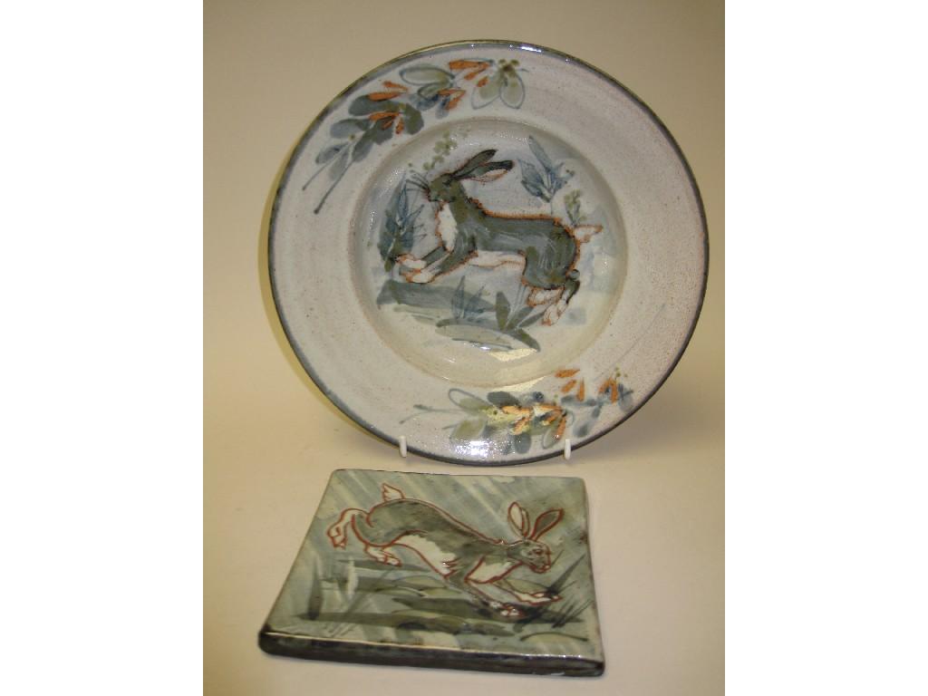 Appraisal: A Studio Pottery Bowl and Tile decorated hares by Colin