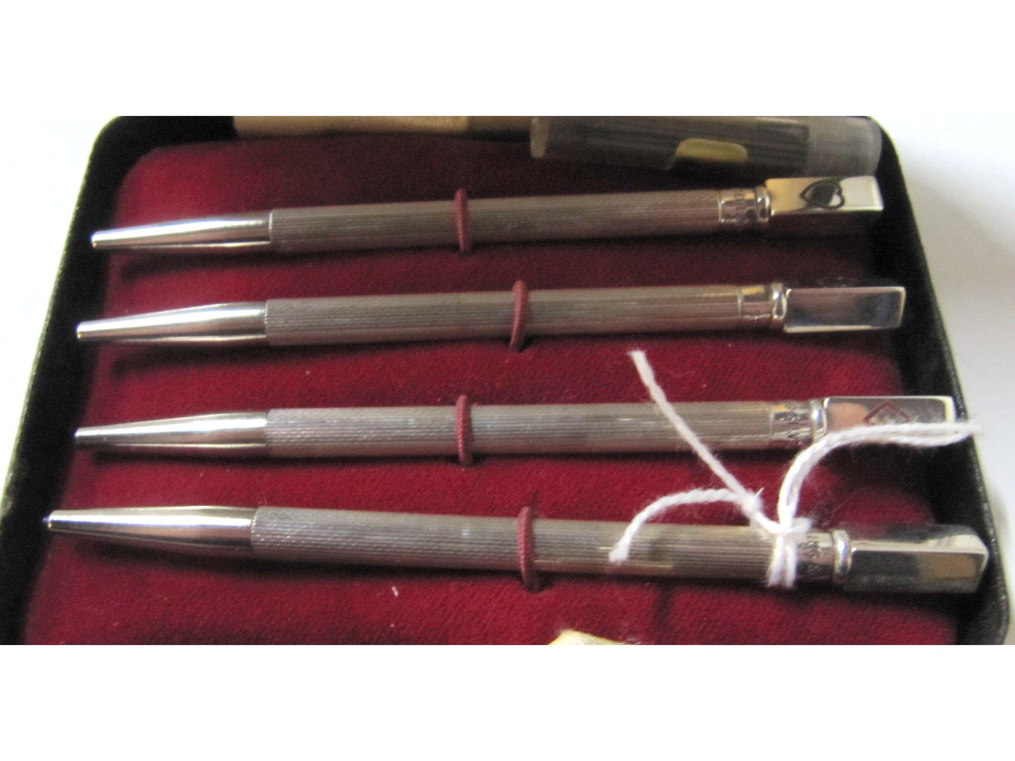 Appraisal: A cased set of sterling silver bridge pencils