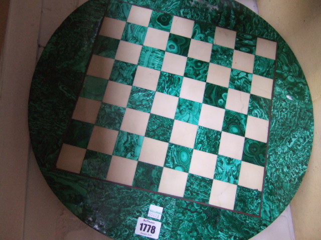 Appraisal: A malachite chess board of circular form th century with