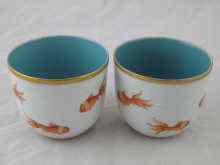 Appraisal: A pair of Chinese ceramic tea bowls with fish scale