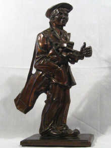 Appraisal: A cast metal figure of a golfer circa impressed mark