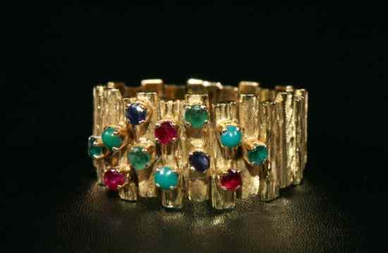 Appraisal: YELLOW GOLD AND COLORED GEMSTONE CONTEMPORARY DESIGN BAND Cross-hatched and