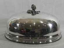 Appraisal: A large Victorian silver plated meat cover with artichoke handle