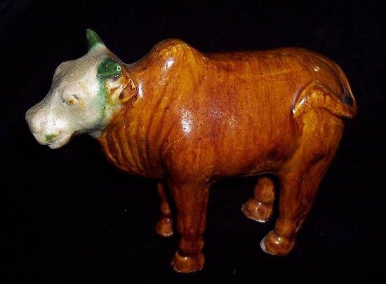 Appraisal: A Tang pottery figure of a bull glazed in green