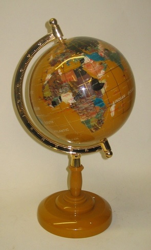 Appraisal: A REVOLVING WORLD GLOBE with table pedestal base The globe