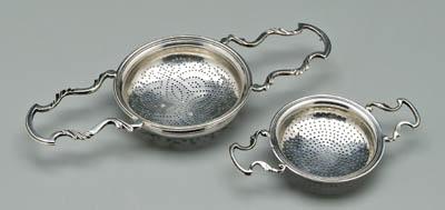 Appraisal: Two George II punch strainers both English silver with round