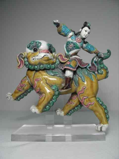 Appraisal: Chinese polychrome glazed ceramic roof tile Depicts a man riding