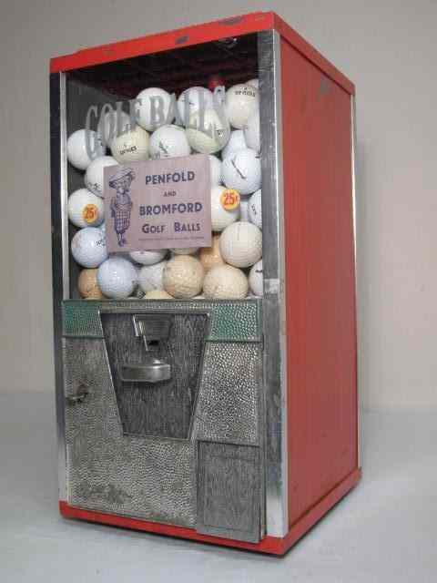 Appraisal: Vintage cent golf ball dispenser Red painted metal case with