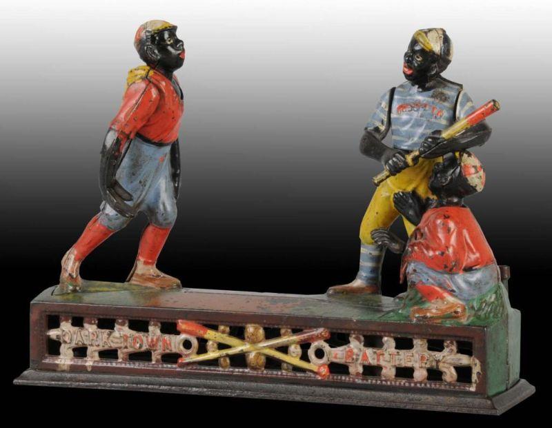 Appraisal: Cast Iron Dark Town Battery Mechanical Bank Description Manufactured by