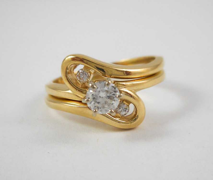 Appraisal: DIAMOND AND FOURTEEN KARAT GOLD WEDDING SET including a size