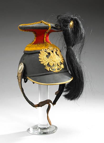 Appraisal: An Austro-Hungarian lancer's czapskadated Black leather skull with red wool