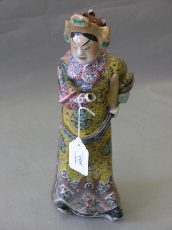 Appraisal: A th century Chinese porcelain figure standing position clothed in