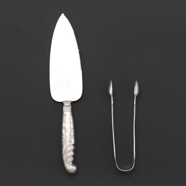 Appraisal: STERLING TONGS AND CAKE KNIFE London sterling silver tongs weighs