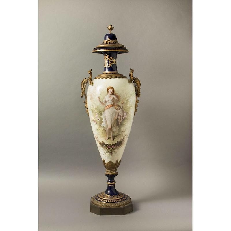 Appraisal: Sevres Style Covered Porcelain Urn Sevres style bronze mounted porcelain