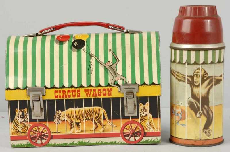 Appraisal: Circus Wagon Metal Lunchbox Thermos Description This box has minor