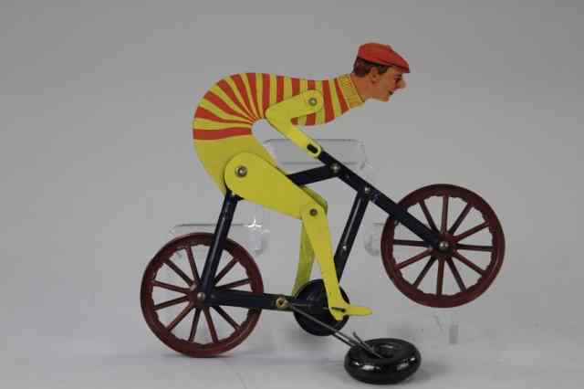 Appraisal: TURTLE NECK BICYCLIST STRING TOY A C Gilbert lithographed tin