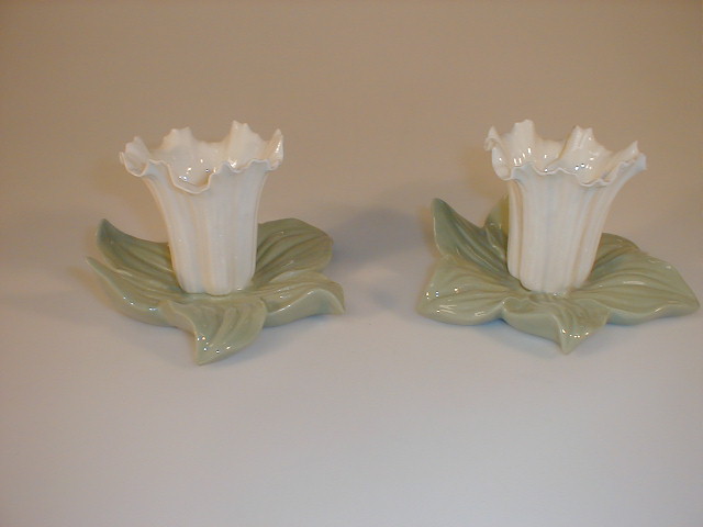 Appraisal: A pair of Graingers Worcester vases each modelled as a