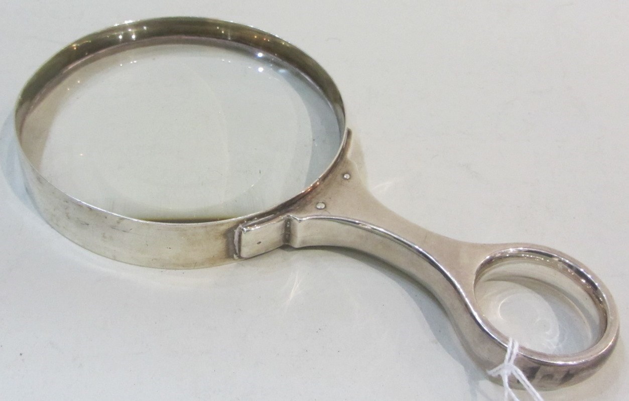 Appraisal: A silver mounted magnifying glass fitted with a circular lens