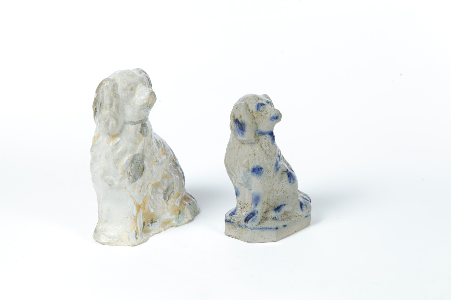 Appraisal: POTTERY DOGS Ohio late th to early th century Spaniels