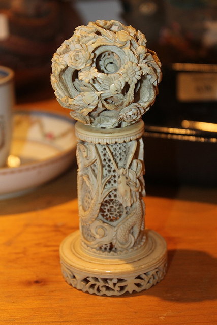 Appraisal: A CHINESE CARVED IVORY PUZZLE BALL and stand approximately cm