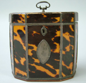 Appraisal: A George III tortoiseshell and silver strung decagonal tea caddy