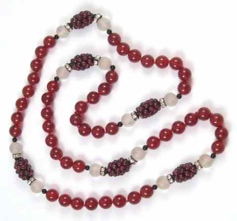 Appraisal: RED GLASS BEADED NECKLACE with six clusters of red garnet-like