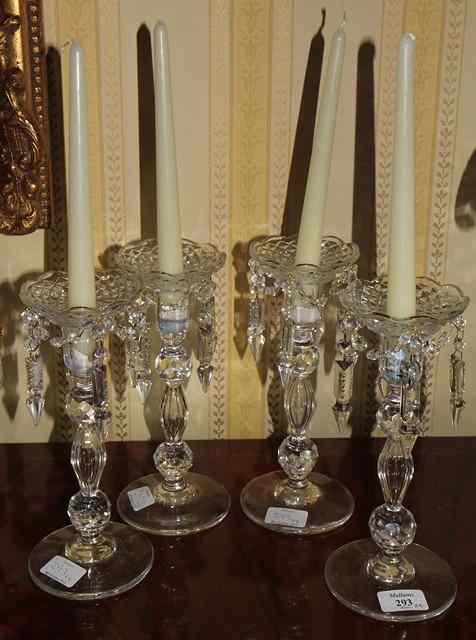 Appraisal: A SET OF FOUR CUT GLASS CANDLESTICKS with faceted knops